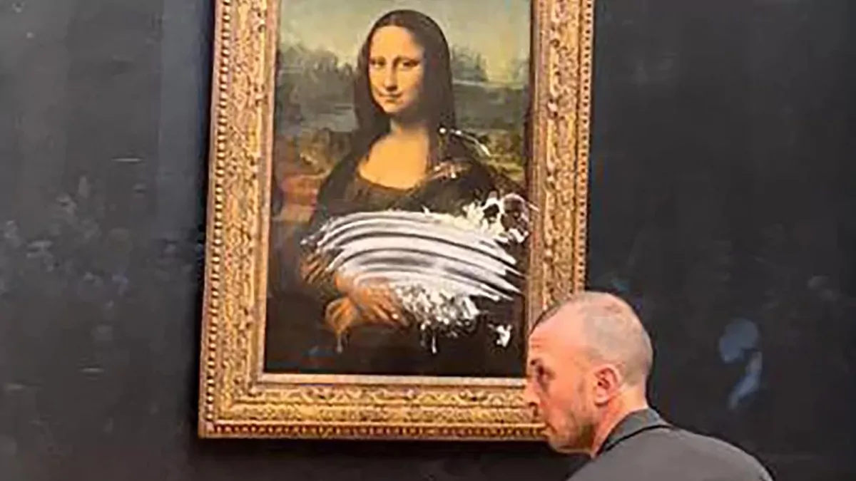 Watch: Man disguised as 'old woman' attacks Mona Lisa with cake