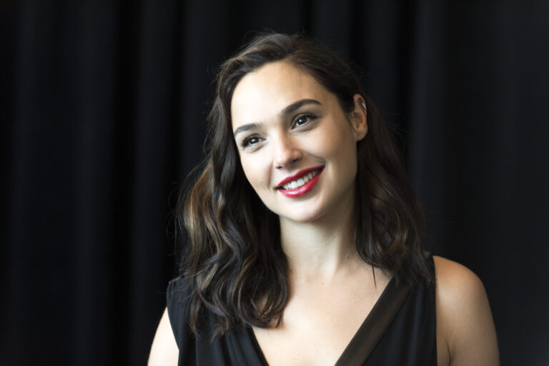 Gal Gadot Stuns Fans as She Rides Bike on Beach in a Suit